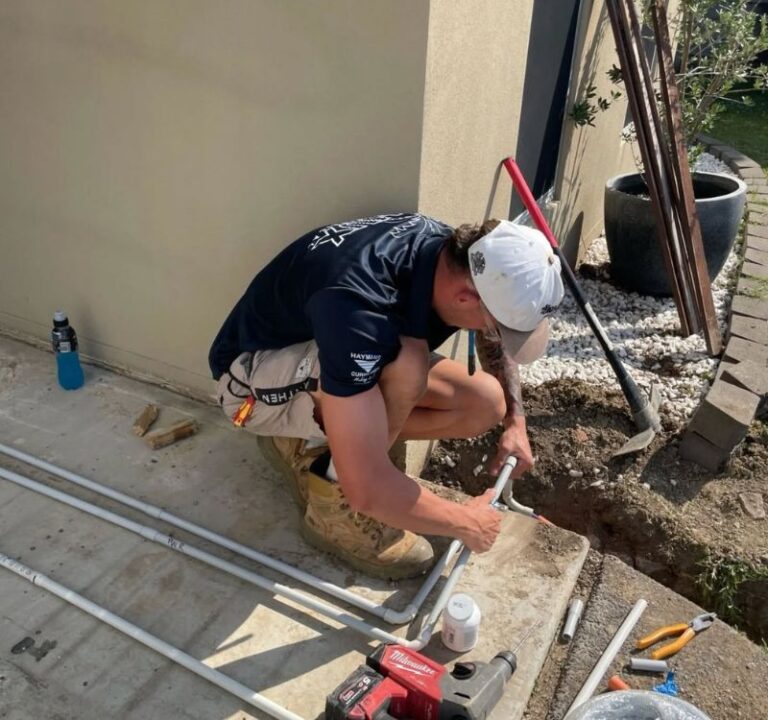 HUX electrician laying underground conduit at a Gold Coast home