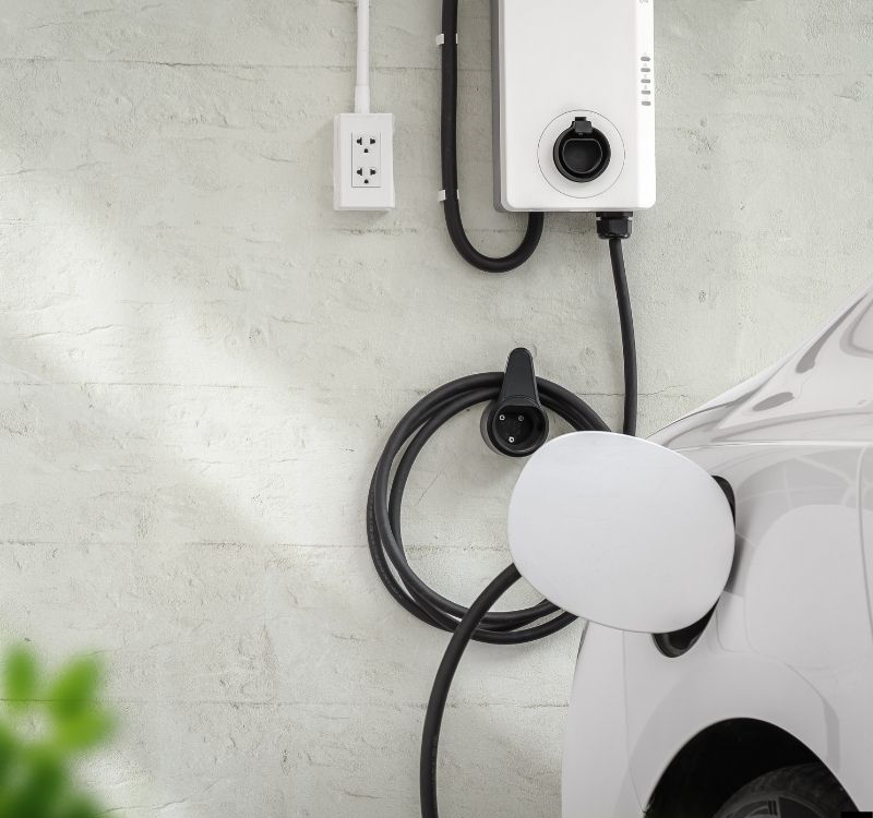 Wall-mounted home EV charger installed by HUX Electrical
