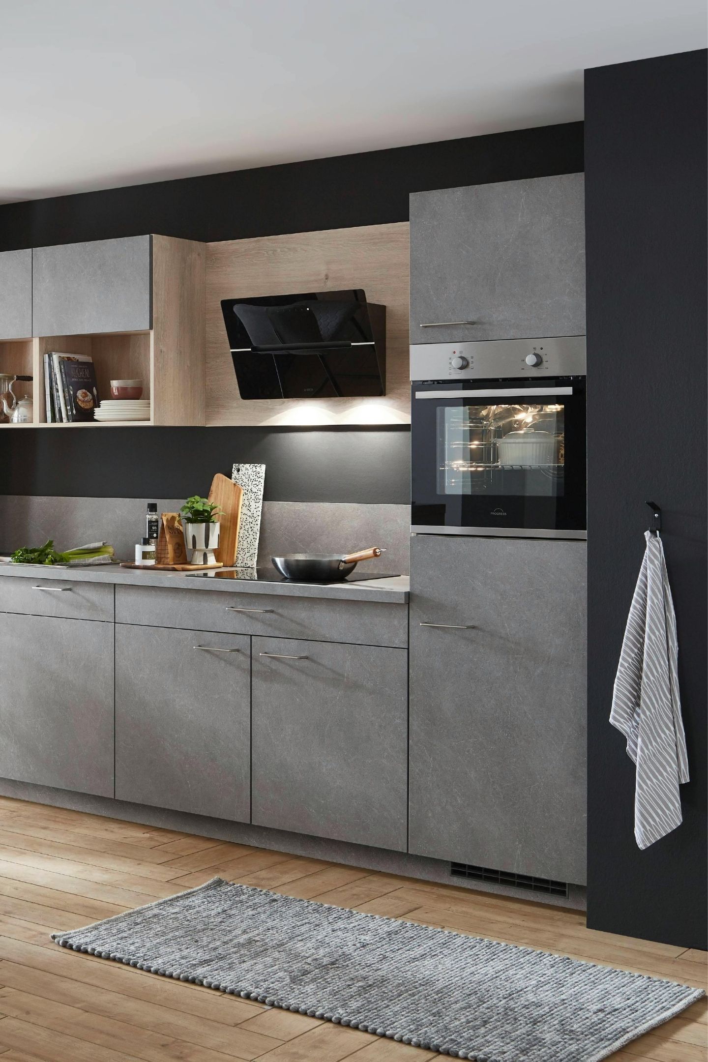 Built-in oven and rangehood installed in a modern kitchen