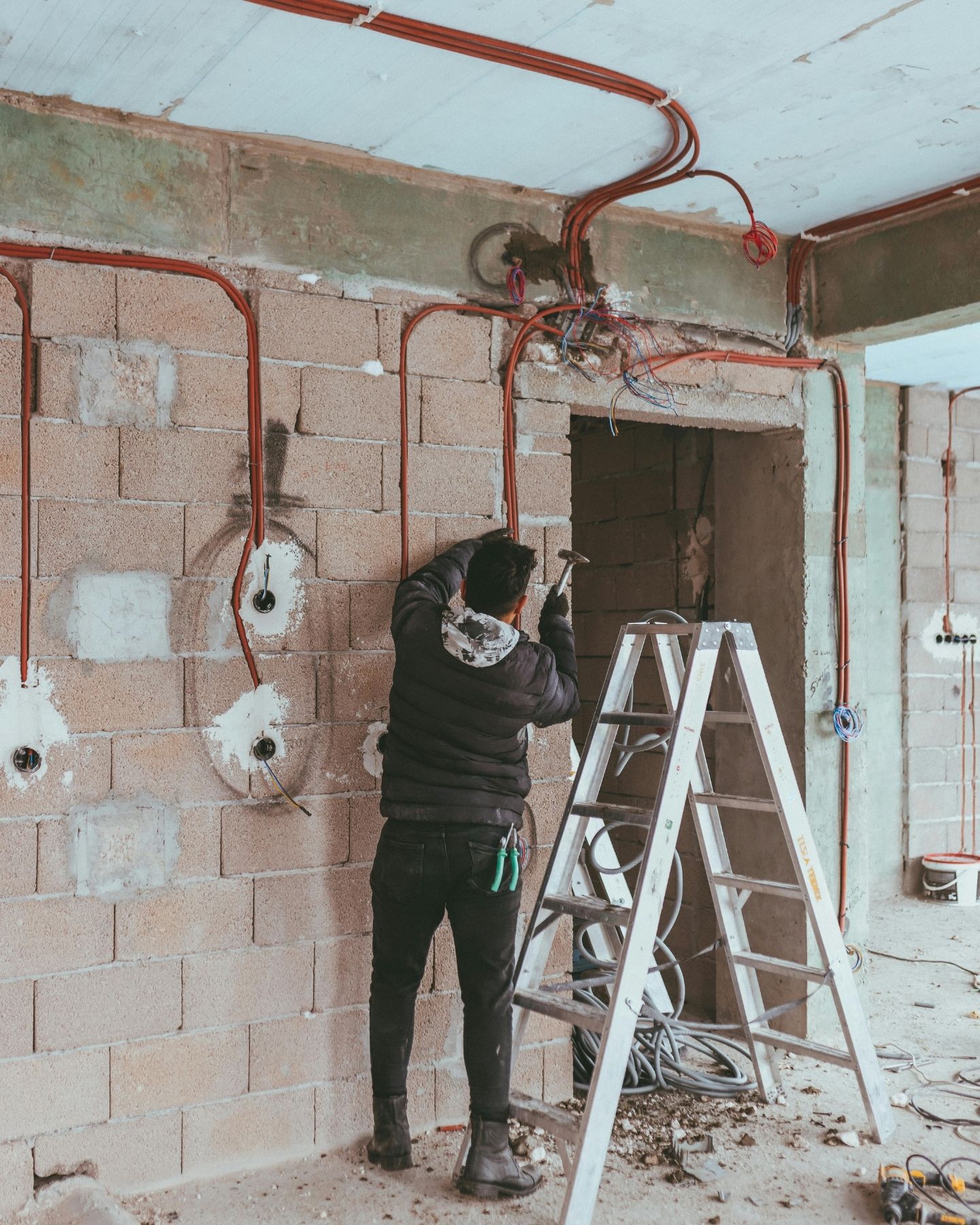 Electrician doing rough-in wiring on a renovation, Gold Coast